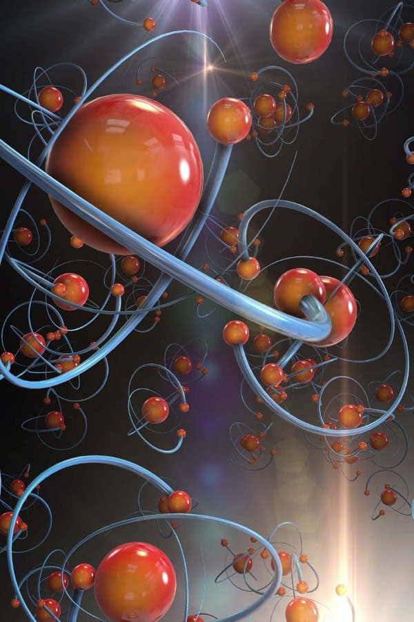 A digital illustration of atoms with red and orange spheres representing protons and electrons, surrounded by blue energy orbits, set against a dark background with a lens flare effect.