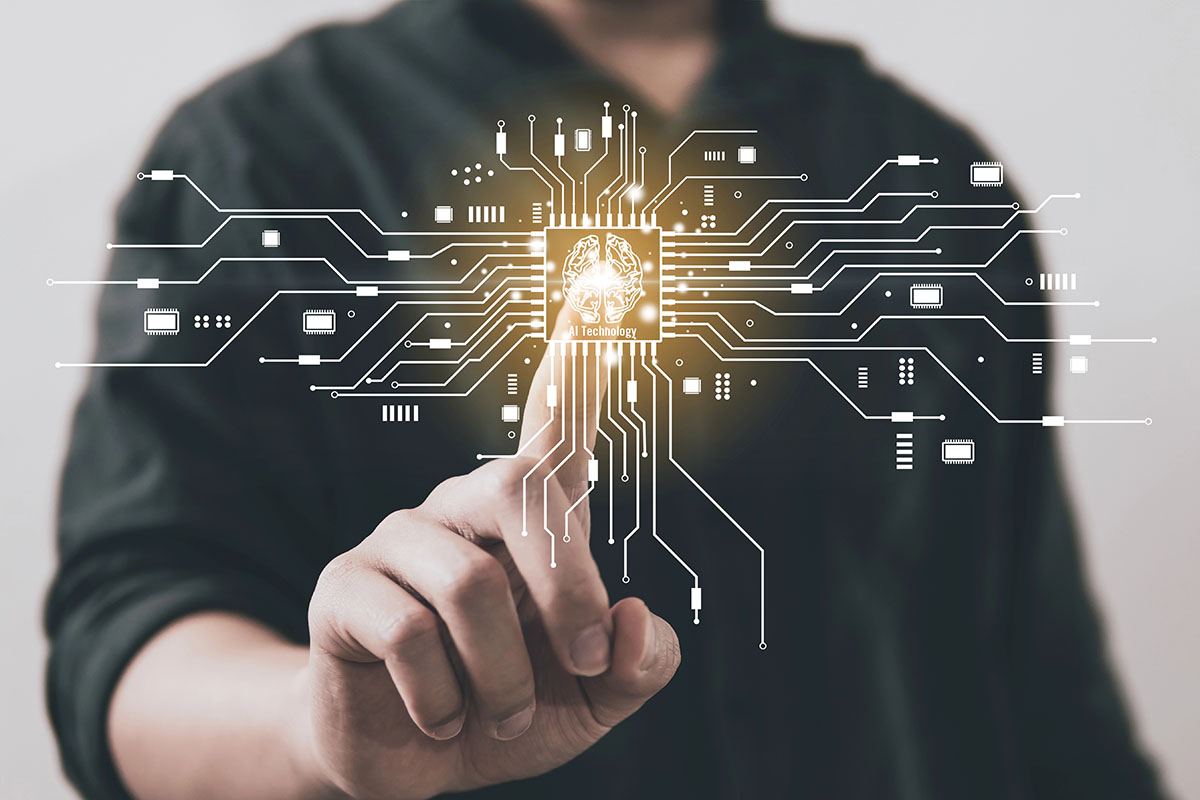 IT Automation A person in a dark shirt touches a glowing circuit board with lines connecting various electronic components, featuring an icon of a brain labeled "AI Technology" at the center.