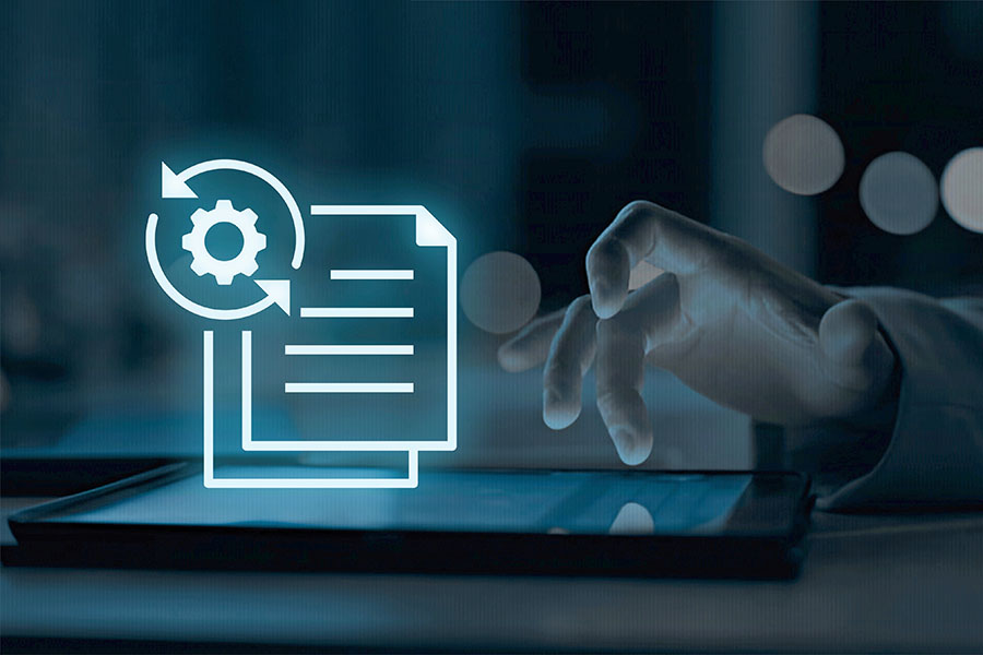 A hand is interacting with a tablet, overlaid with a blue graphic of a document with lines and a gear symbol, indicating a process of updating or managing information.